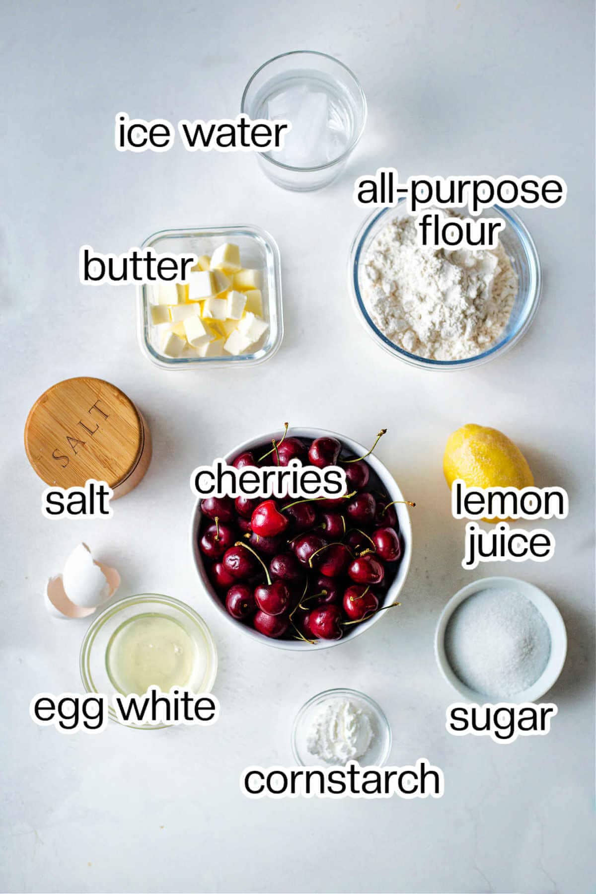 Ingredients needed to make a rustic cherry tart.