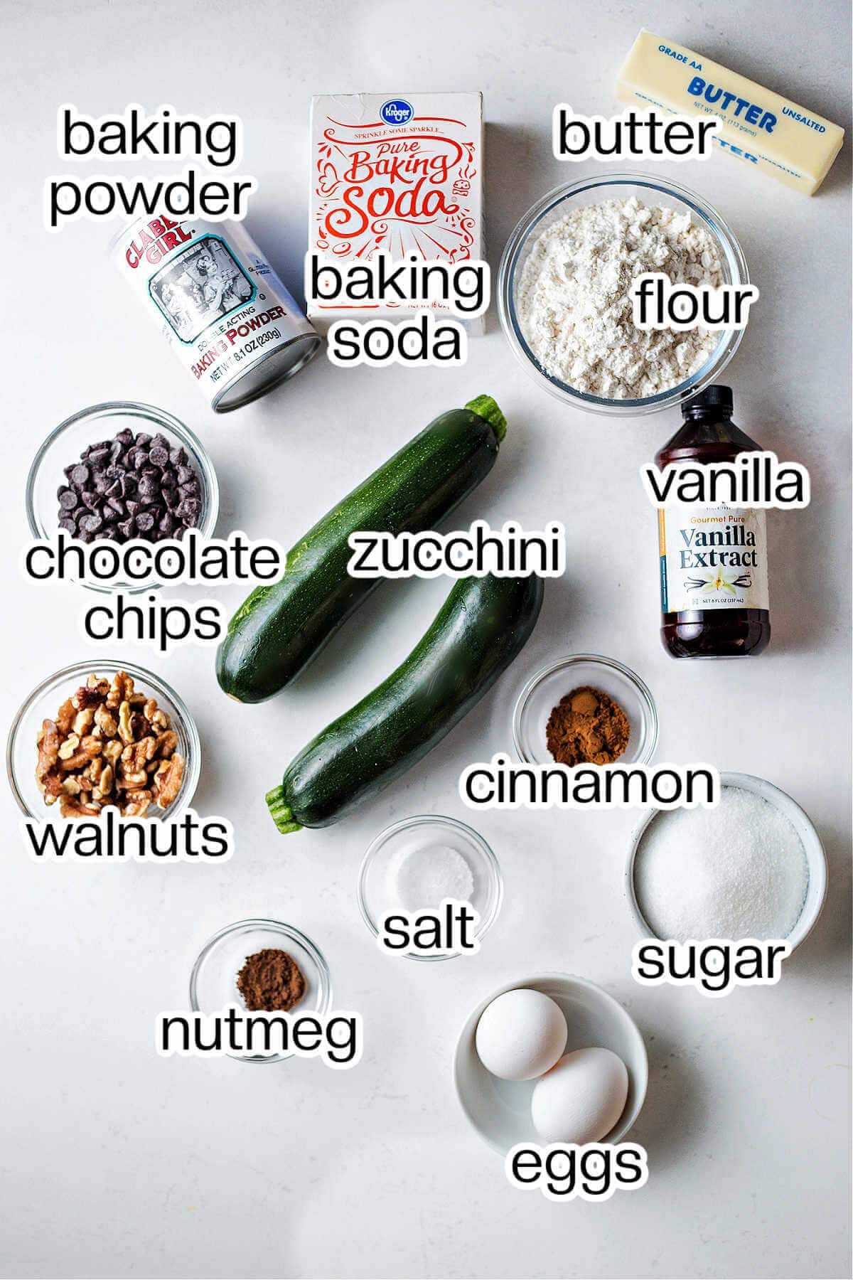 Labeled photo of the ingredients needed to make chocolate chip zucchini bread.