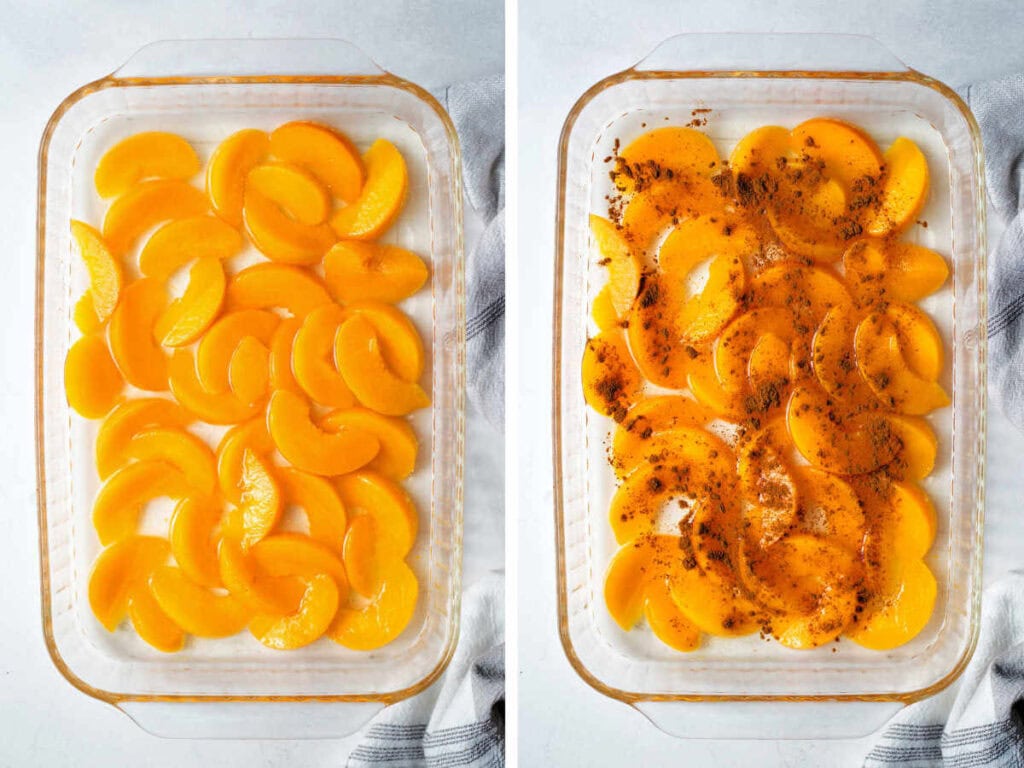 Sliced canned peaches in a baking dish with cinnamon on top.