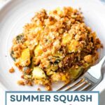 Portion of summer squash casserole on a white plate.