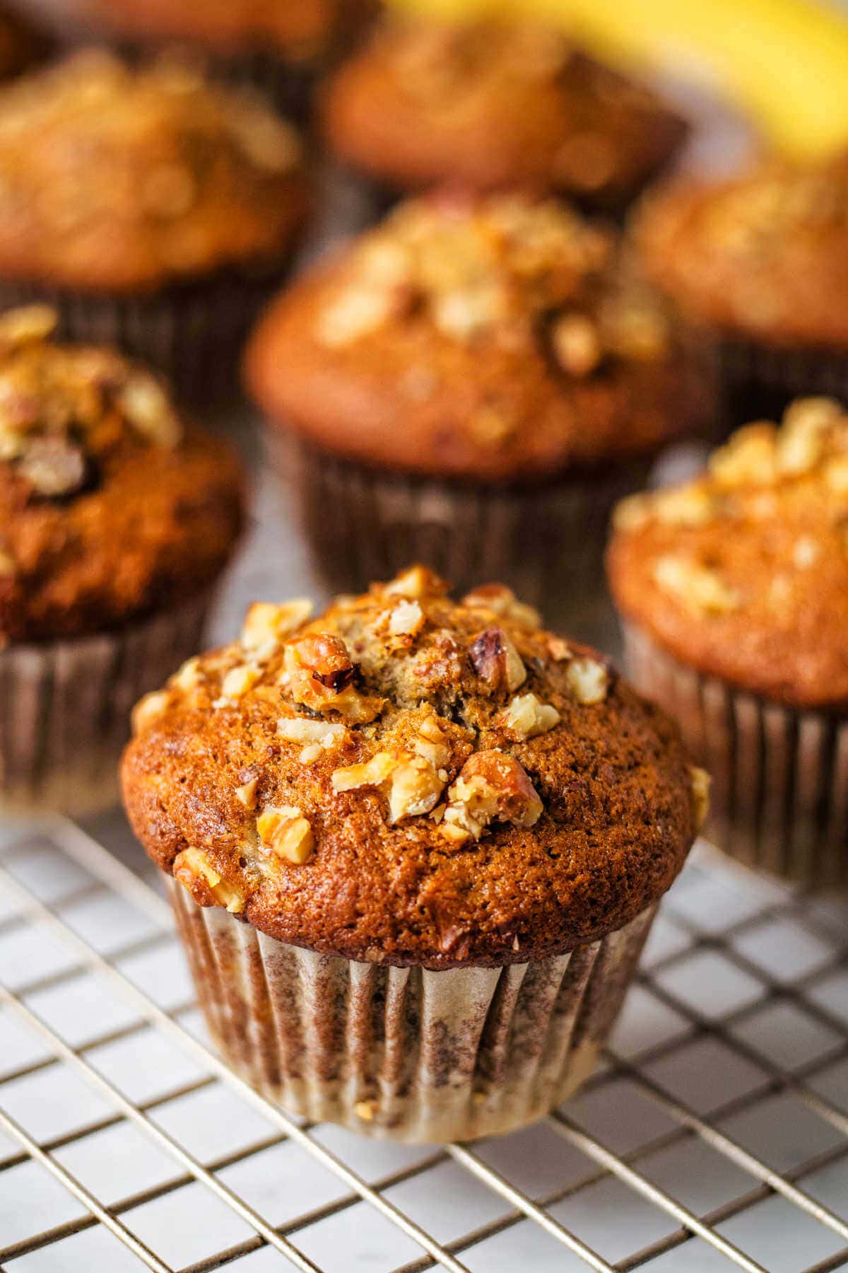 Banana nut muffins on a cooling rack.