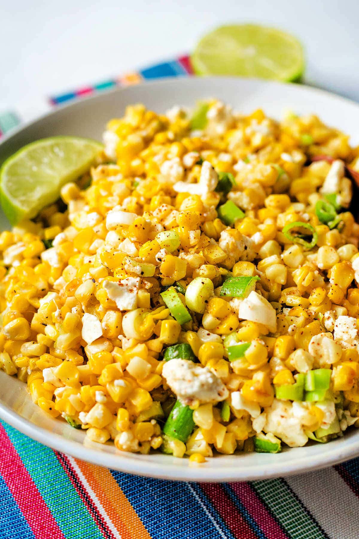 Side view of Mexican corn salad in a bowl.