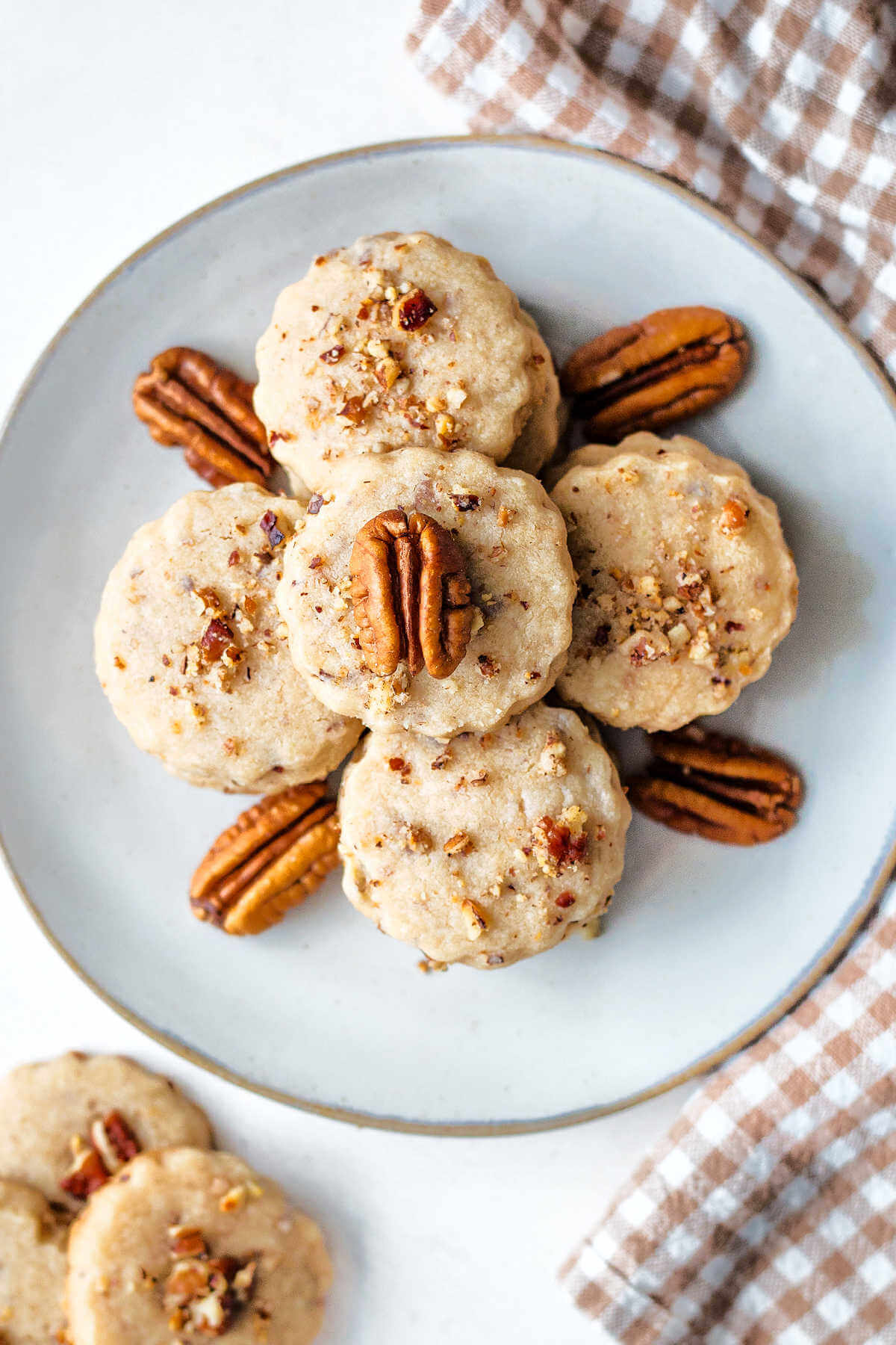 Overhead shot of pecan shortbread cookies on a plate.