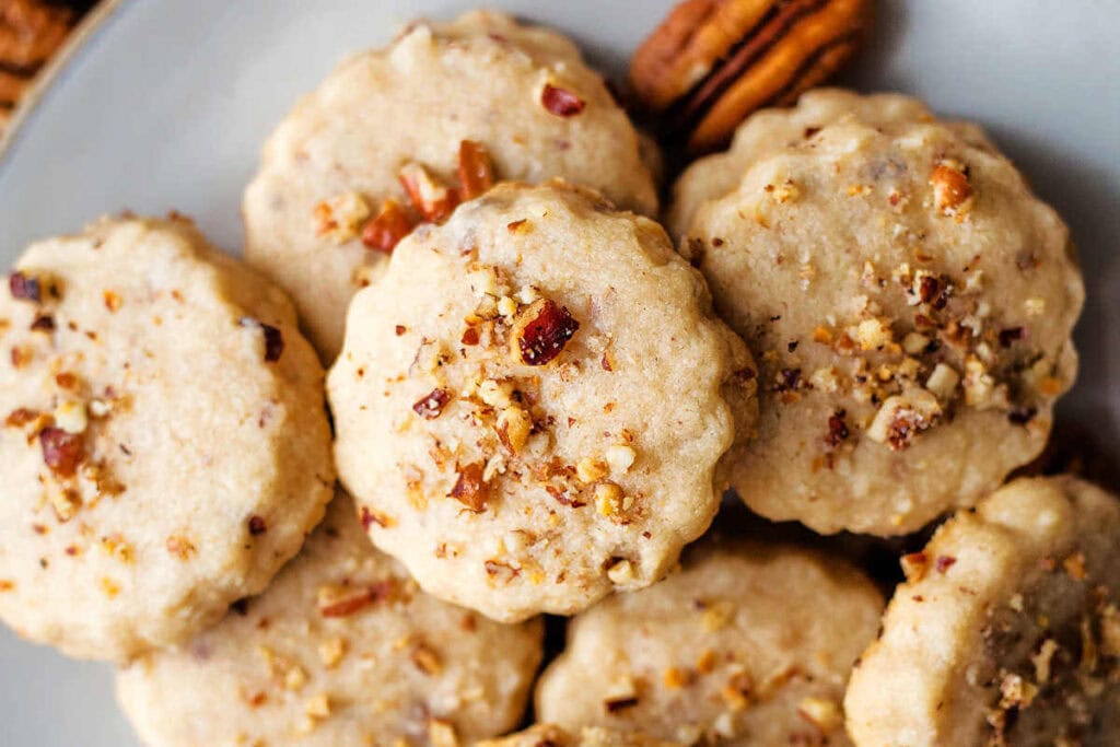 Close up of pecan shortbread cookies on a plate.