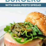 Chicken Burgers dressed with tomato, pesto, arugula, and mozzarella cheese.