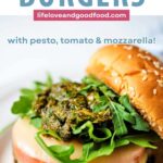 Chicken Burgers dressed with tomato, pesto, arugula, and mozzarella cheese.
