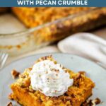 A slice of Pumpkin Dump Cake topped with whipped cream.