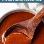Homemade BBQ Sauce in a bowl with a wooden spoon.