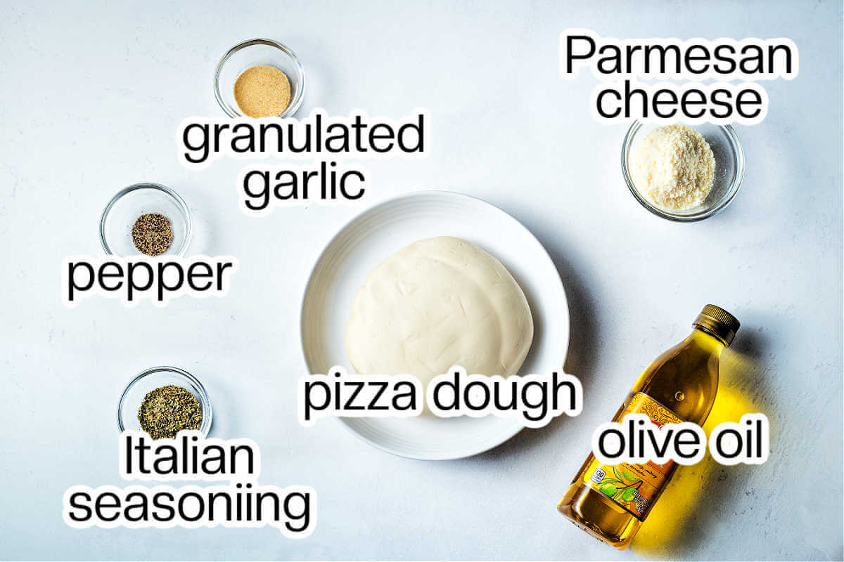 Ingredients needed to make cheesy garlic breadsticks.