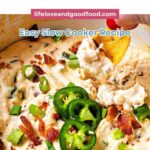 Dipping a chip into Slow Cooker Jalapeno Popper Dip.