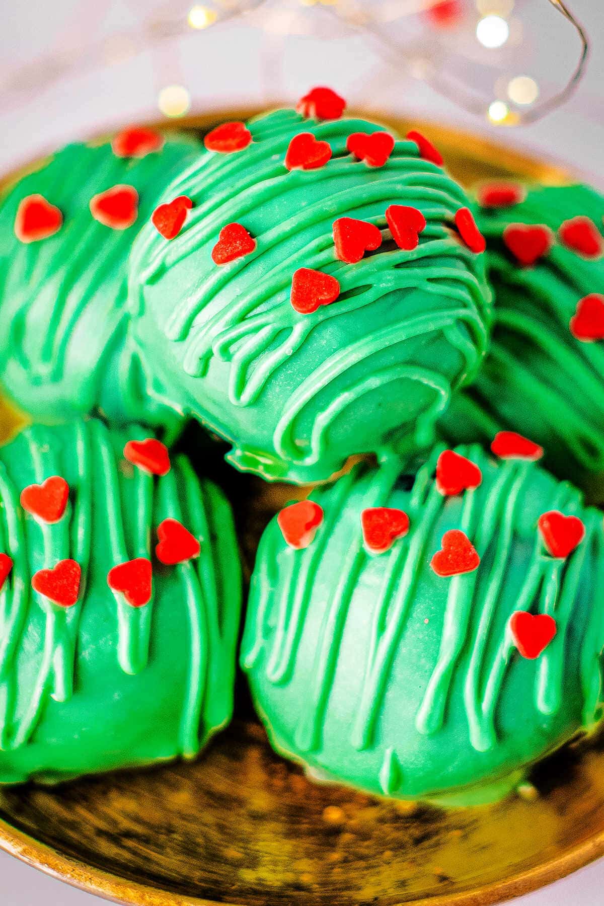 Close up of Christmas Oreo balls on a small plate.