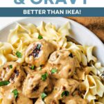 Swedish Meatballs and Gravy over noodles on a plate.