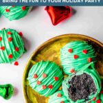 Christmas Oreo Balls on a gold plate.