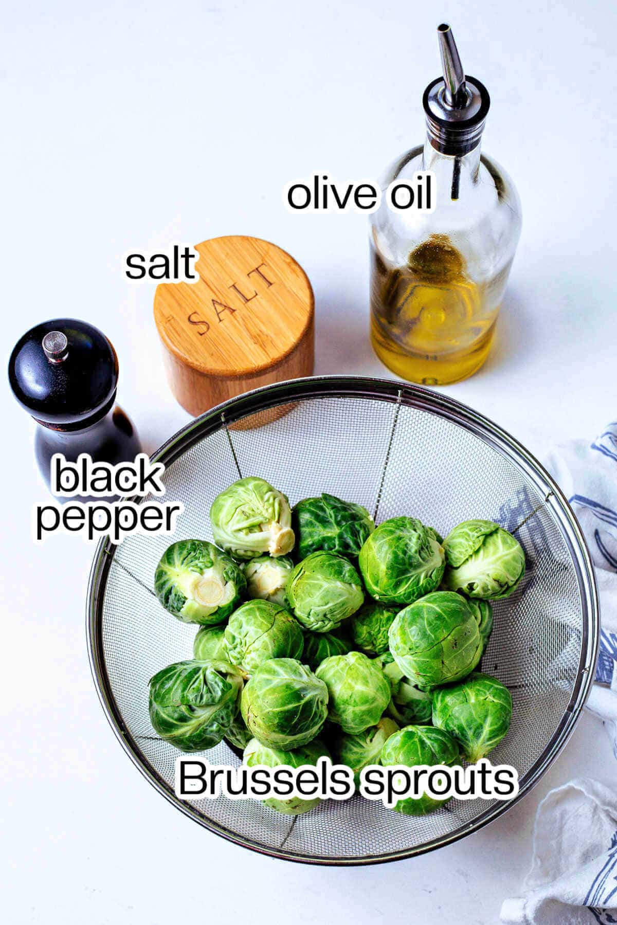 Ingredients for air fried Brussels sprouts on a table.