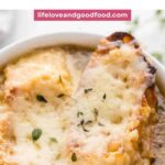 French Onion Soup in a bowl with cheesy toast on top.