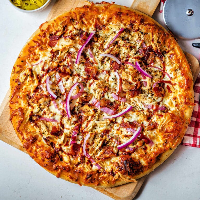 BBQ Chicken Pizza on a pizza peel.