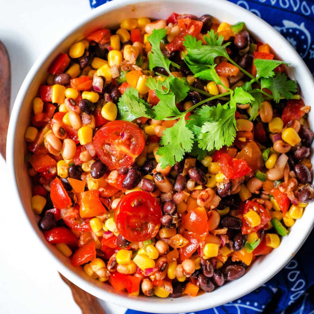 Cowboy Caviar garnished with cilantro leaves in a bowl.