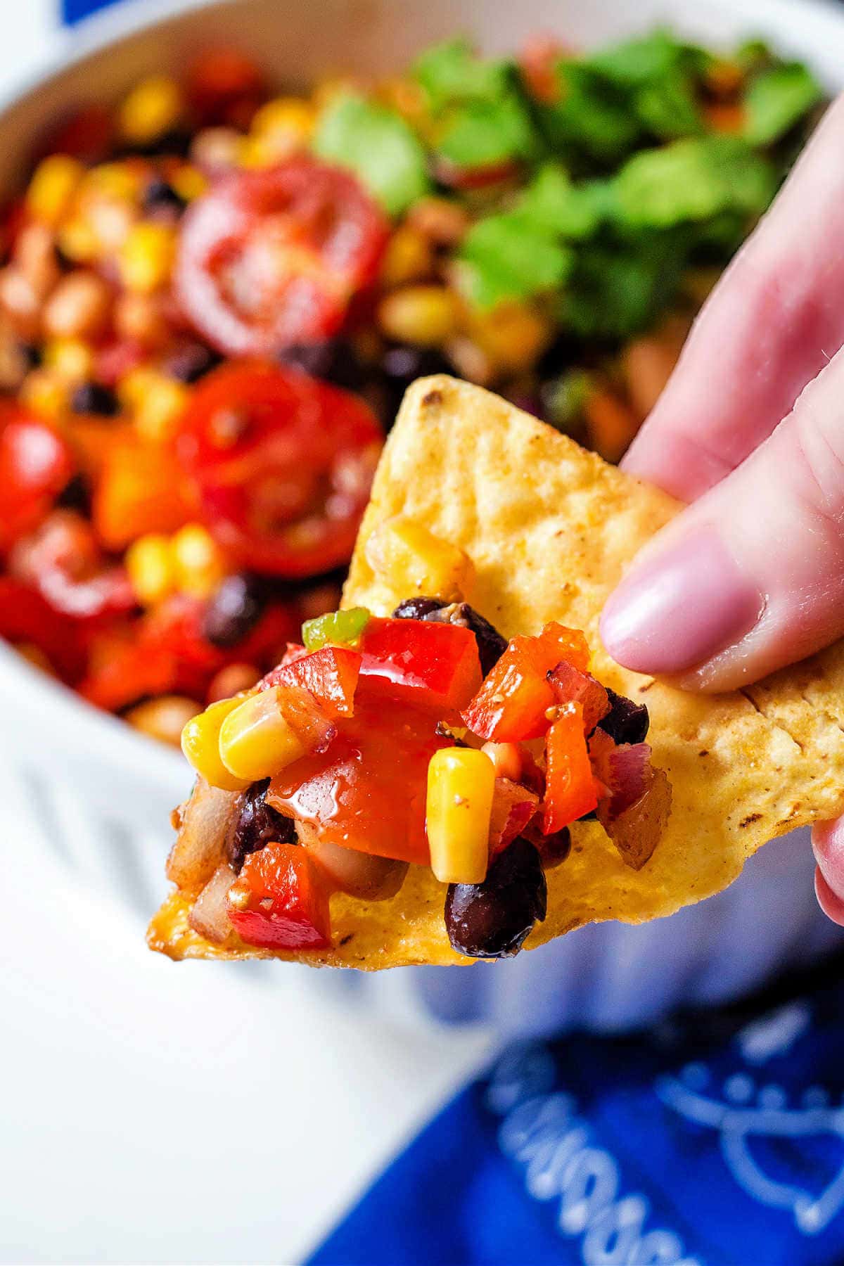 Tortilla chip with cowboy caviar on it.