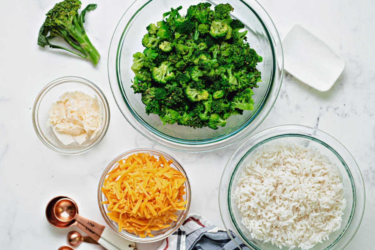 ingredients for a casserole: broccoli, rice, cheddar cheese, parmesan cheese.