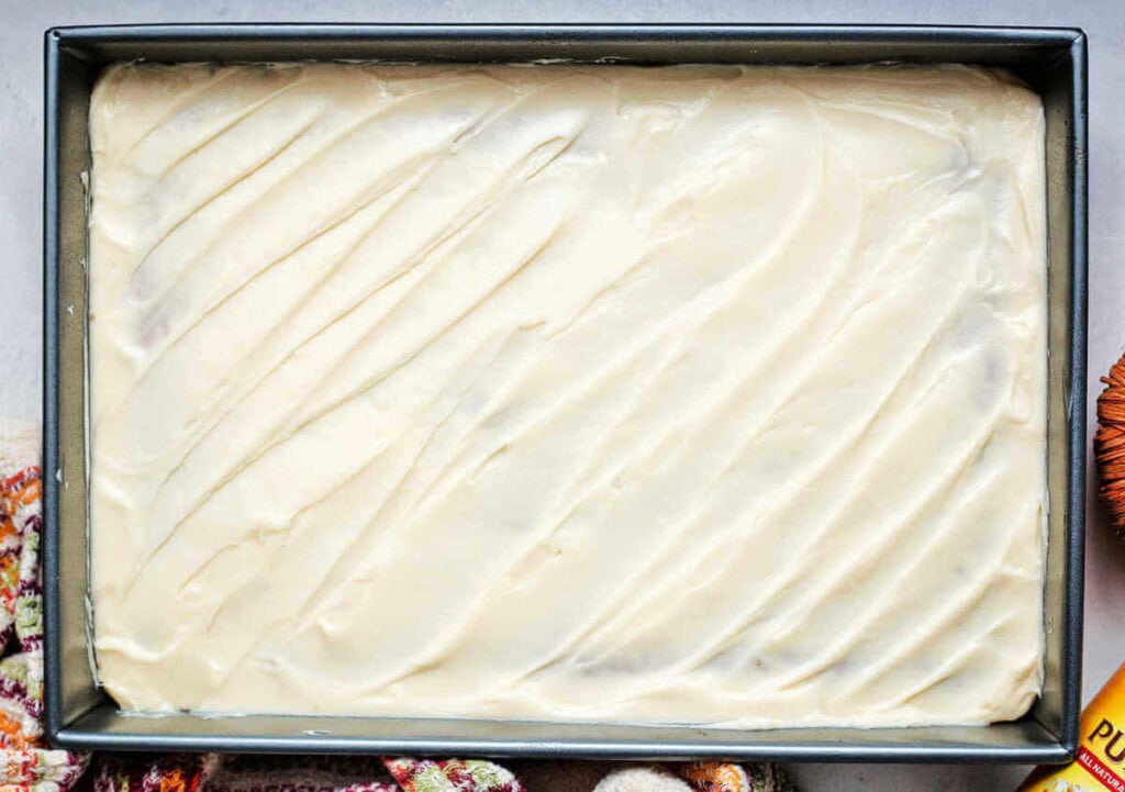 A pan of Libby's pumpkin bars frosted with cream cheese icing.